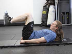 Reverse crunches, position 1 of 2